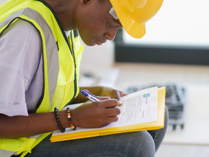 Cleaning contractor completing paperwork before starting a job