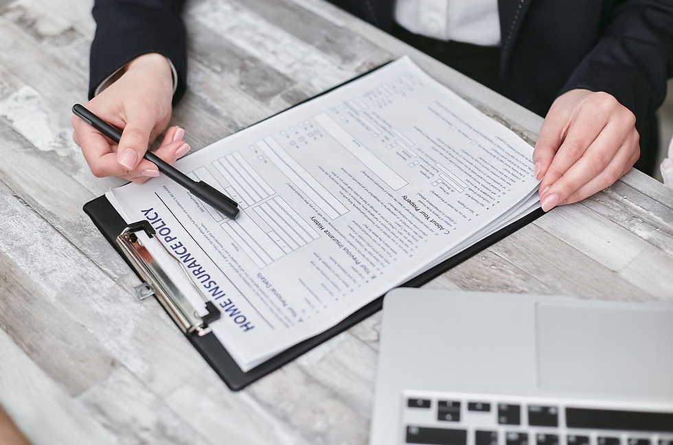 Notary stamp, official record journal, dual-tray laser printer, and loan signing document stack arranged on a wooden desk.