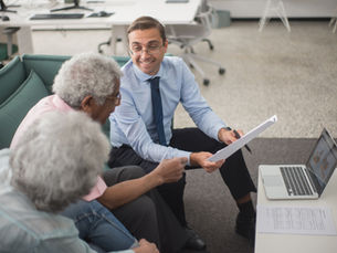 Professional insurance broker reviewing policy documents and premium statements for E&O tax deductions.