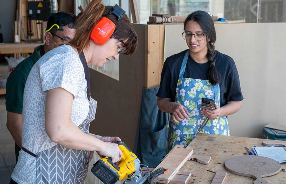 Person deeply focused during a woodworking class at The Makers Society