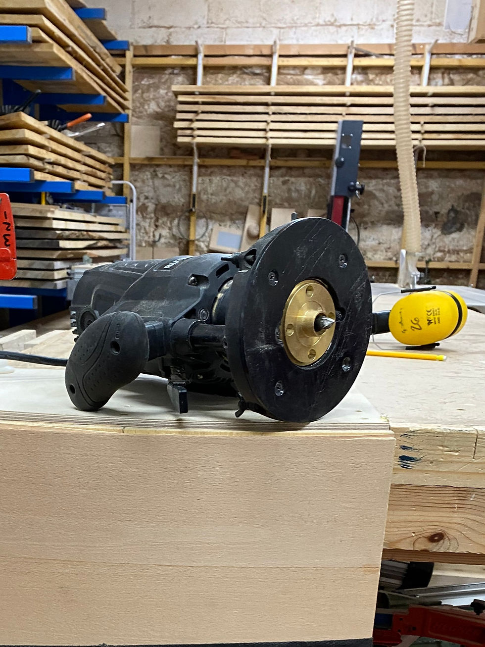 A router with a straight bit and a collar