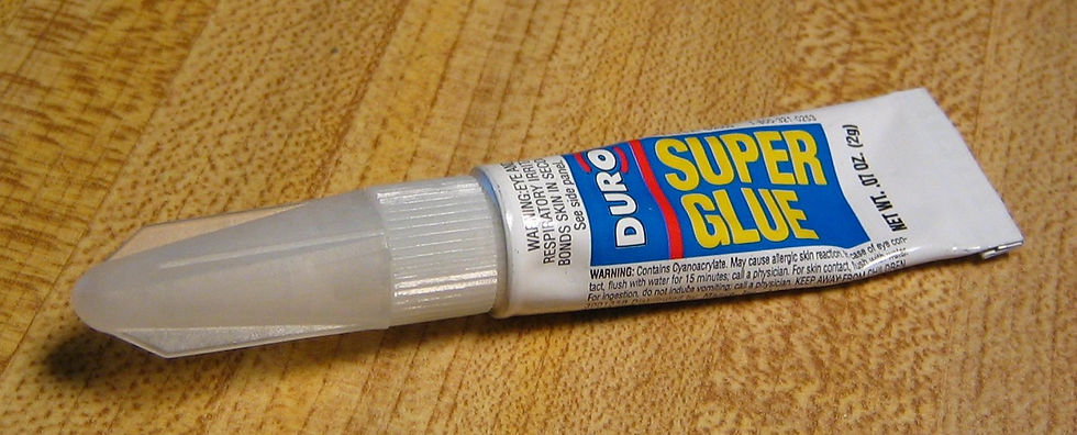 Super Glue sets in a matter of seconds (so it doesn't require clamping) and is widely used not only for small repairs but also in the making of jigs, to hold pieces together.