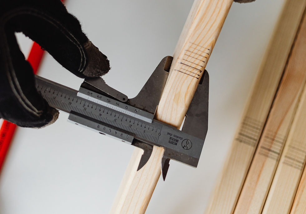 A veneer caliper measures the thickness of a piece of wood