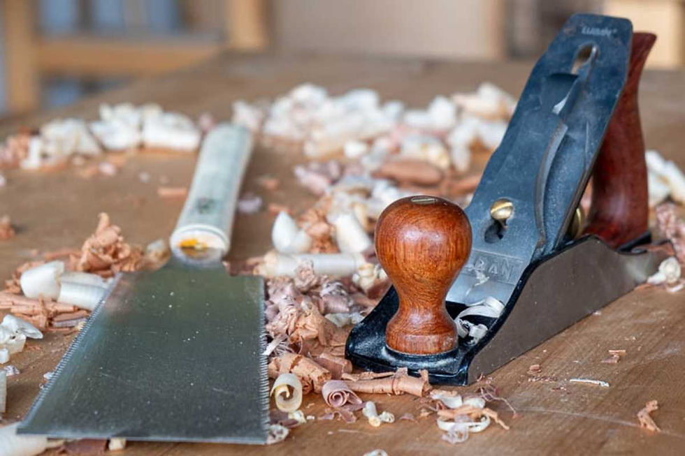 Traditional woodworking hand planes and tools on a workbench in Dubai