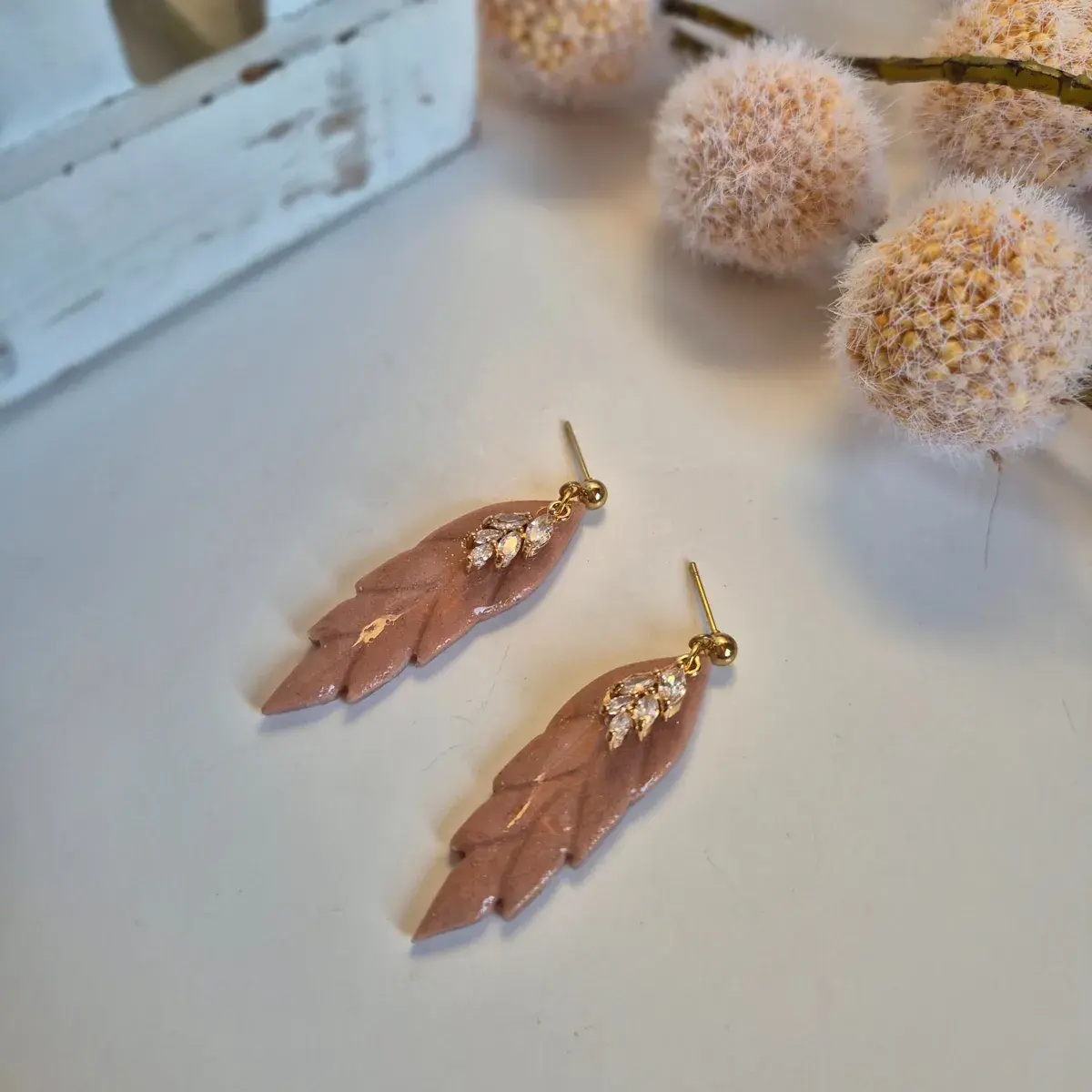Rose shimmer polymer clay leaf earrings with gold crystal detail – handcrafted dangle earrings.