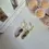 Thumbnail: Glossy white marbled polymer clay resin earrings with gold finish – modern artisan jewellery design