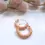 Thumbnail: Neutral beige polymer clay hoop earrings with gold accents