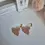 Thumbnail: Handmade floral clay earrings with gold accents and petal silhouette