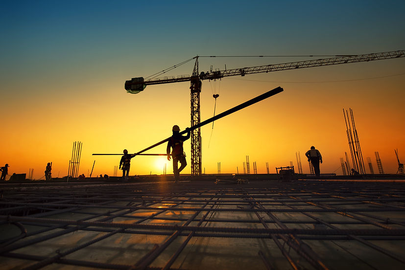 silhouette-construction-workers-fabricating-steel-reinforcement-bar-at-the-construction-si