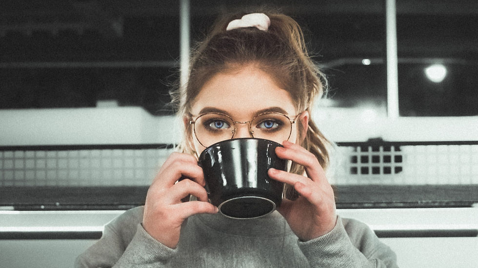 Girl contemplates her self-awareness and insight while sipping on a hot drink.