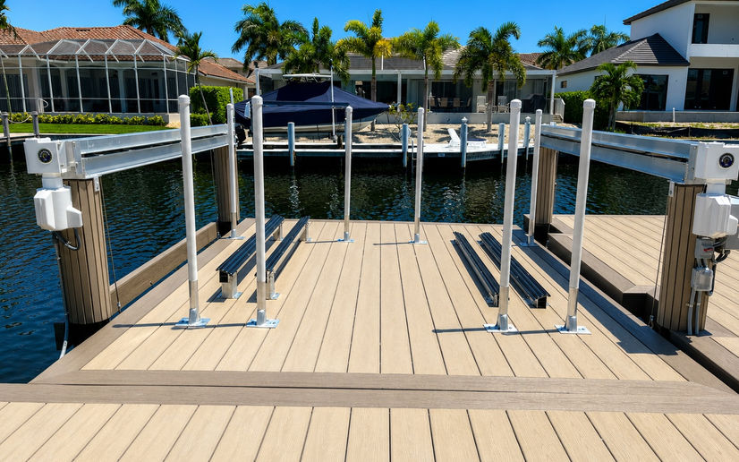 Platform Hi-Tide Lift with composide decking, picture frame, and pile strips. Built by Collier Seawall and Dock LLC.