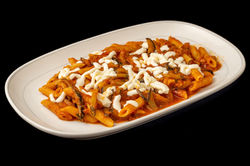 Penne with tomato sauce, eggplant and mozzarella cheese.