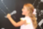 girl pretending to sing