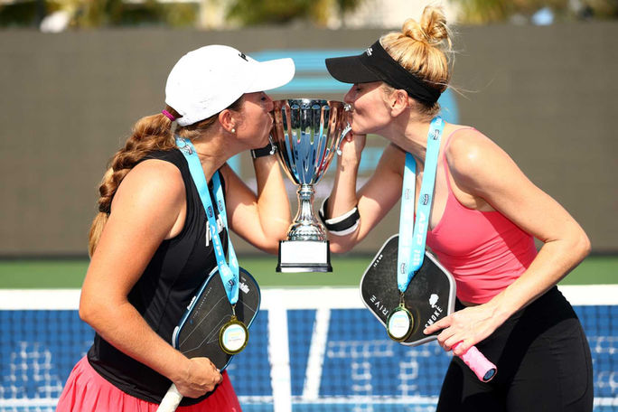 Jill Megan kissing trophy