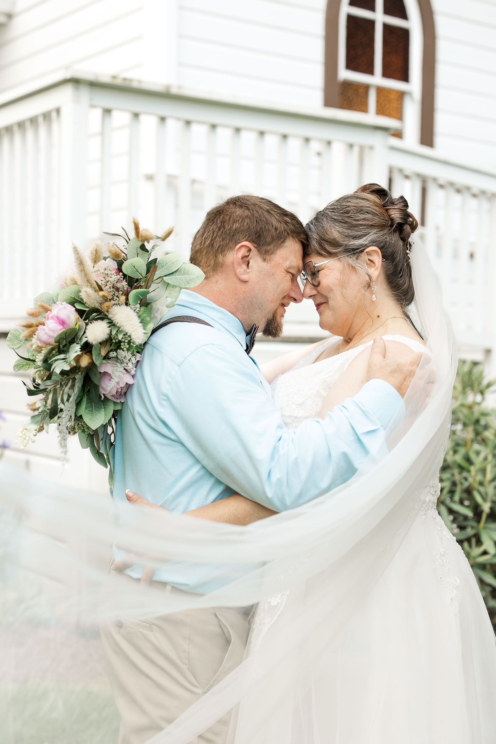 Bride and Groom veil swoop