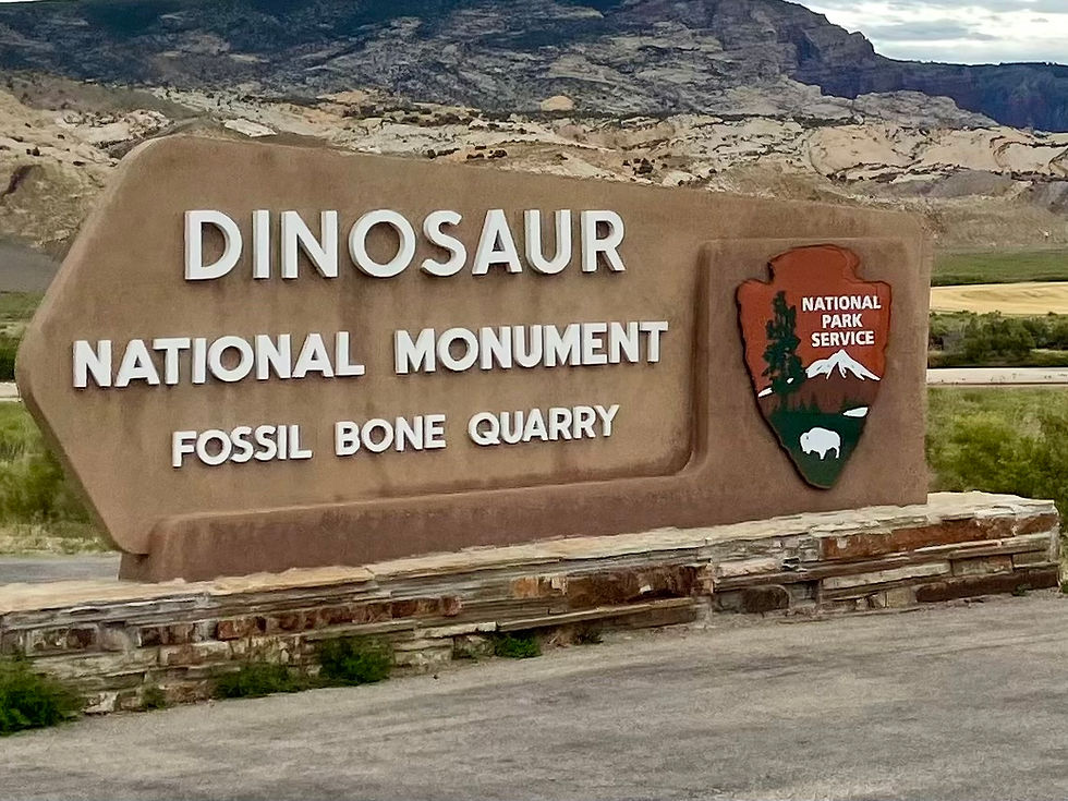 A photo of Dinosaur National Monument sign.