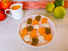Colourful fruit jellies on a plate, made with fruit juice and non allergic ingredients.