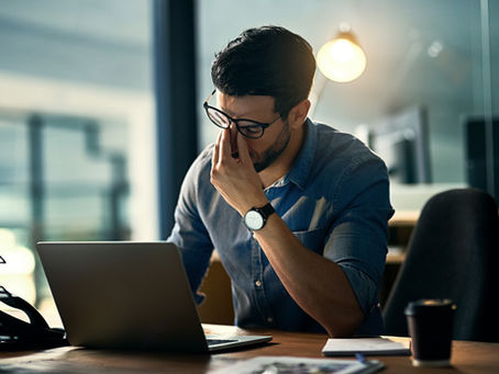 Claude watermark concern shown by a professional reviewing AI-assisted work on a laptop