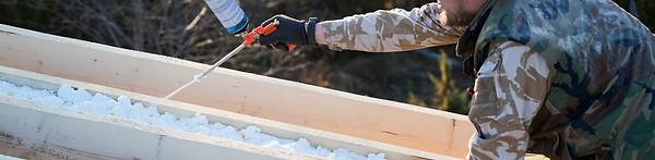 Roofing professional working on a rooftop, demonstrating expert repair and installation services by Sonoran Roofing