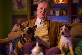 Actor Ian Dickinson with two dogs