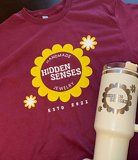 branded logo maroon tshirt and cream tumbler with Hidden Senses logo. Custom printed t-shirts and apparel for small business in Springfield, MO