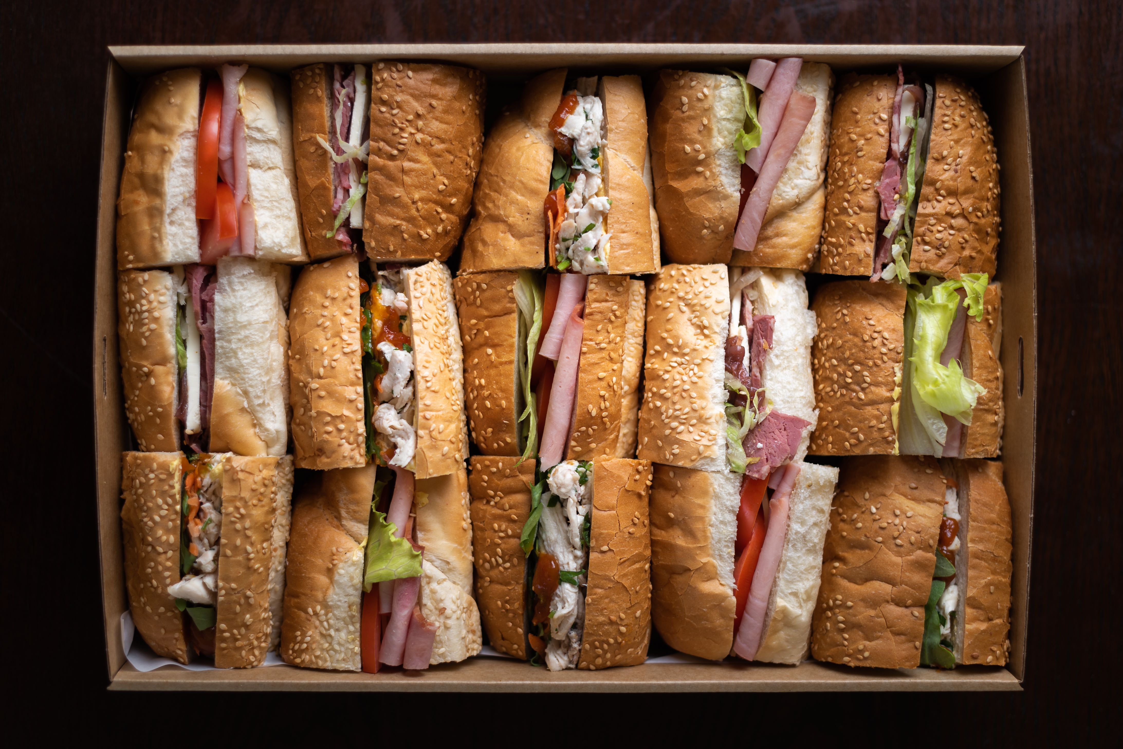 Illustrative assorted sandwiches on a catering tray