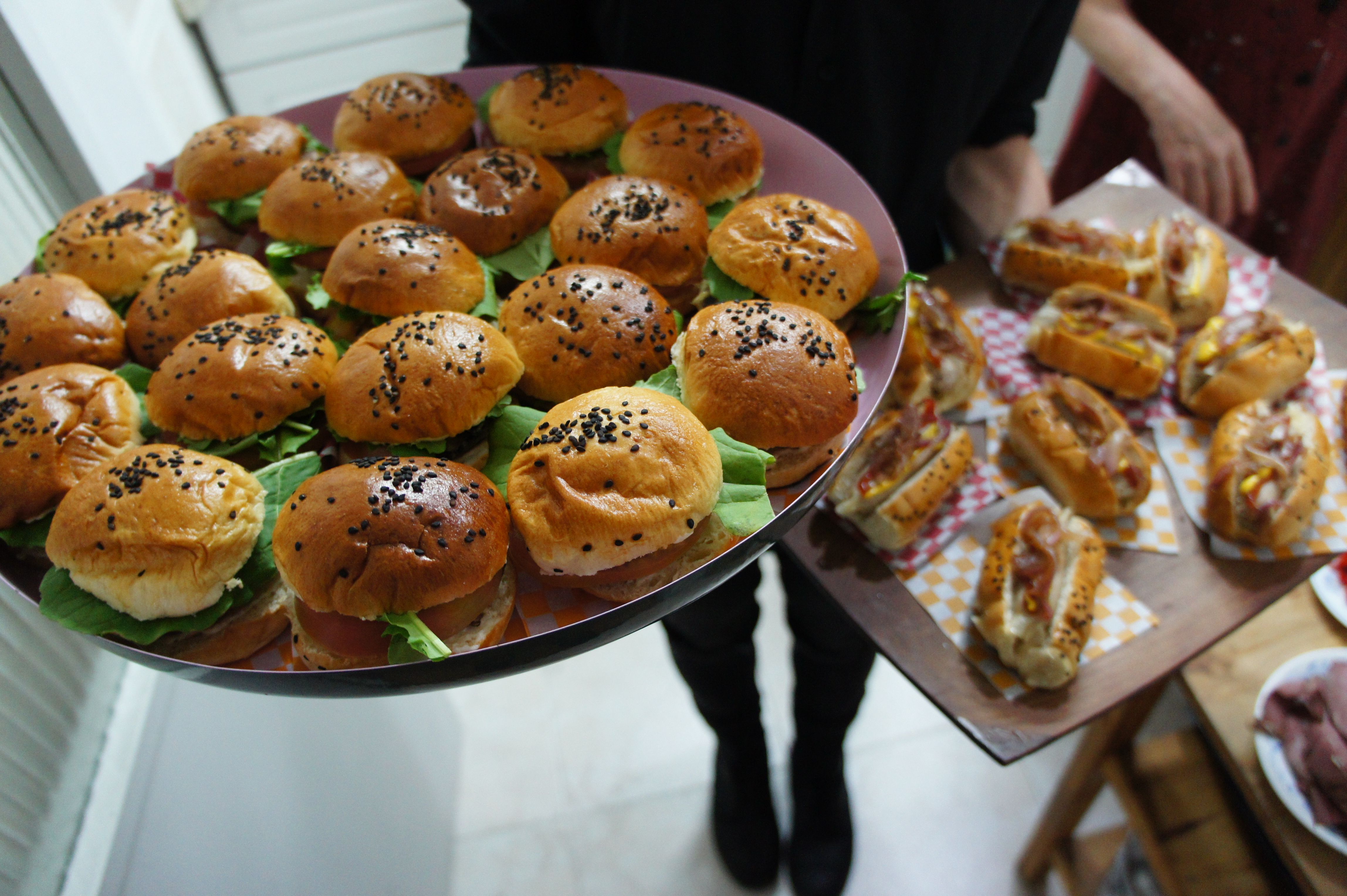 Illustrative tray of mini sandwiches and burgers