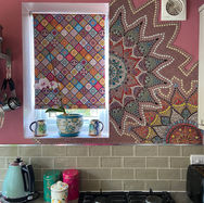 Handmade mosaic kitchen splashback featuring geometric and mandala style patterns in bright colours created at Curious Studio