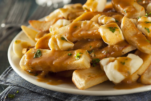 poutine - french fries covered with gravy with cheese curds on top