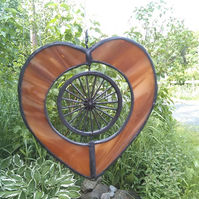 stained glass heart with bicycle wheel