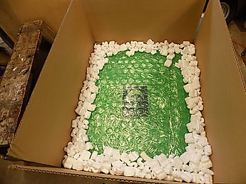 bubble wrapped glass surrounded by peanuts.JPG
