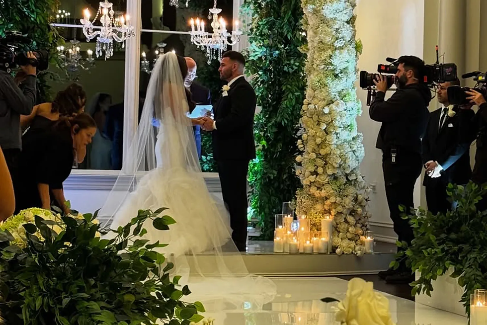 Sammi Giancola and Justin May at the altar. cozzijewelers/Instagram