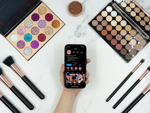 Beauty products and a phone arranged for social media content, illustrating the de-influencing trend