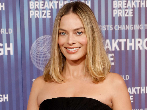 Margot Robbie recalls being handed a book urging her to eat less early in her career