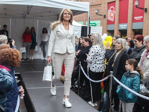 An older model walking a runway, illustrating the expansion of age-inclusive fashion casting