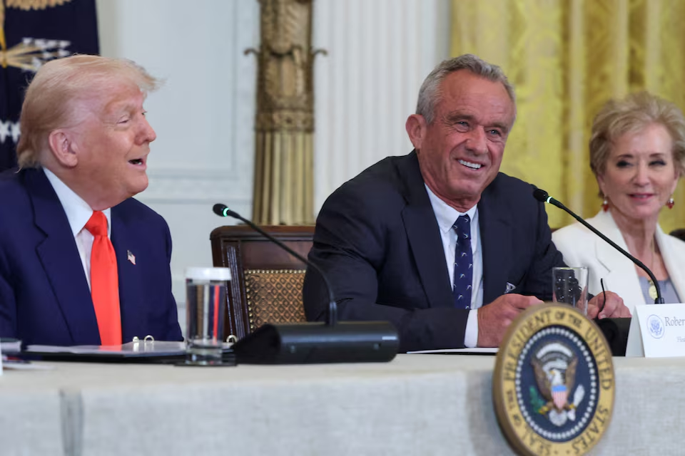U.S. President Donald Trump, Health and Human Services (HHS) Secretary Robert F. Kennedy Jr. and Secretary of Education Linda McMahon attend a Make America Healthy Again (MAHA) Commission event, in the East Room of the White House in Washington, D.C., U.S., May 22, 2025. REUTERS/Evelyn Hockstein/File Photo