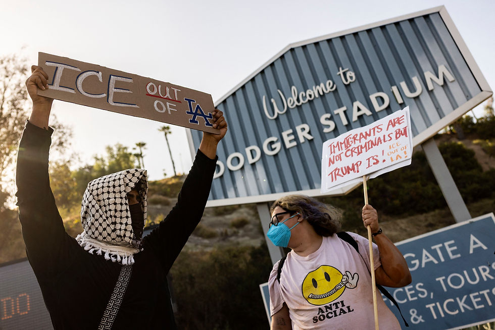 A small group of demonstrators protests outside the entrance of Dodger Stadium on Thursday, claiming the organization supports federal immigration efforts in Los Angeles. Etienne Laurent/AFP/Getty Images