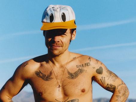 Harry Styles Flaunts Tattoos and Bold Leopard Shorts on a Striking Runner’s World Cover