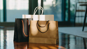 Paper shopping bags in natural light representing U.S. retail spending