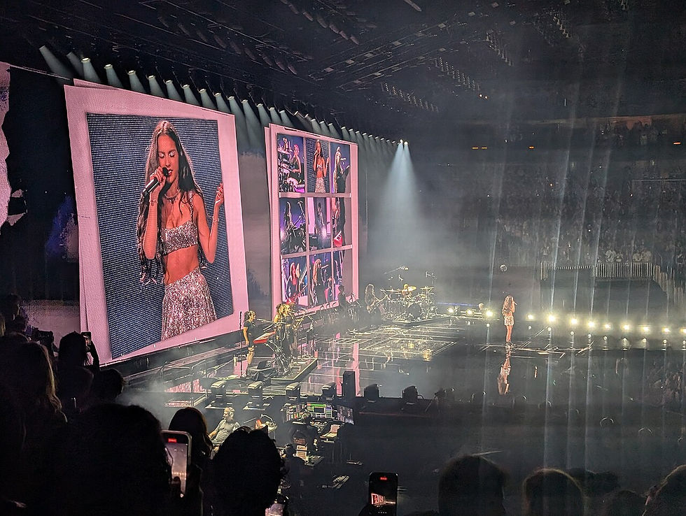 Olivia Rodrigo performs live onstage with a guitar