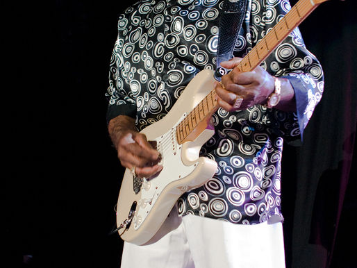 Blues guitarist Buddy Guy performing with an electric guitar during a concert