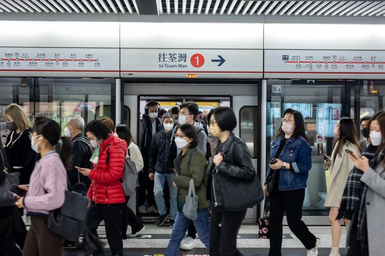 Passengers wear protective face masks in Hong Kong. (Paul Yeung/Bloomberg)