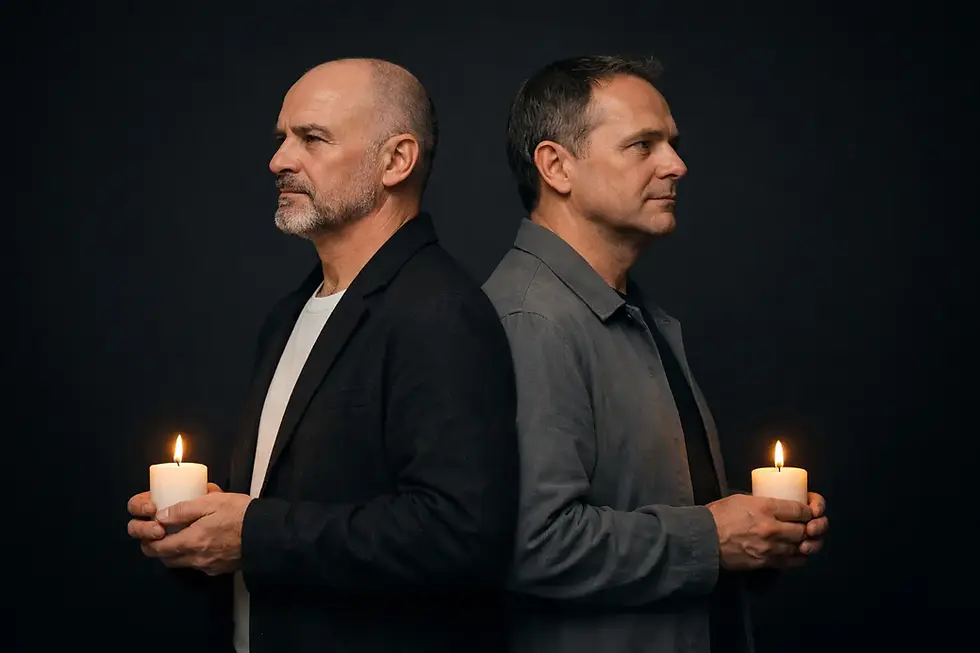 Two men standing back to back holding lit candles against a dark background, symbolizing Christian martyrs Hugh Latimer and Nicholas Ridley and the light of the gospel.