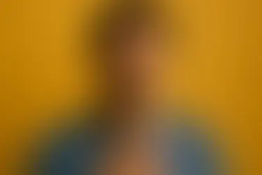 Young person reacting with quiet relief to the message that Jesus bore our sins on the cross