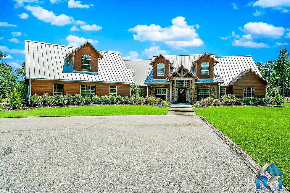 Spacious modern farmhouse living room with custom trim and wood beams