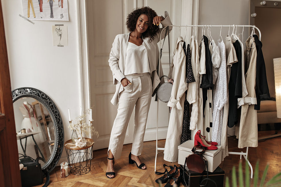fulllength-portrait-stylish-darkskinned-curly-woman-white-pants-jacket-top-posing-dressing