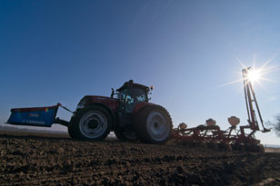 tractor in the field with a planter