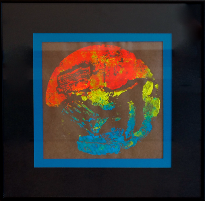 A colorful print in the shape of a circle on a black background.