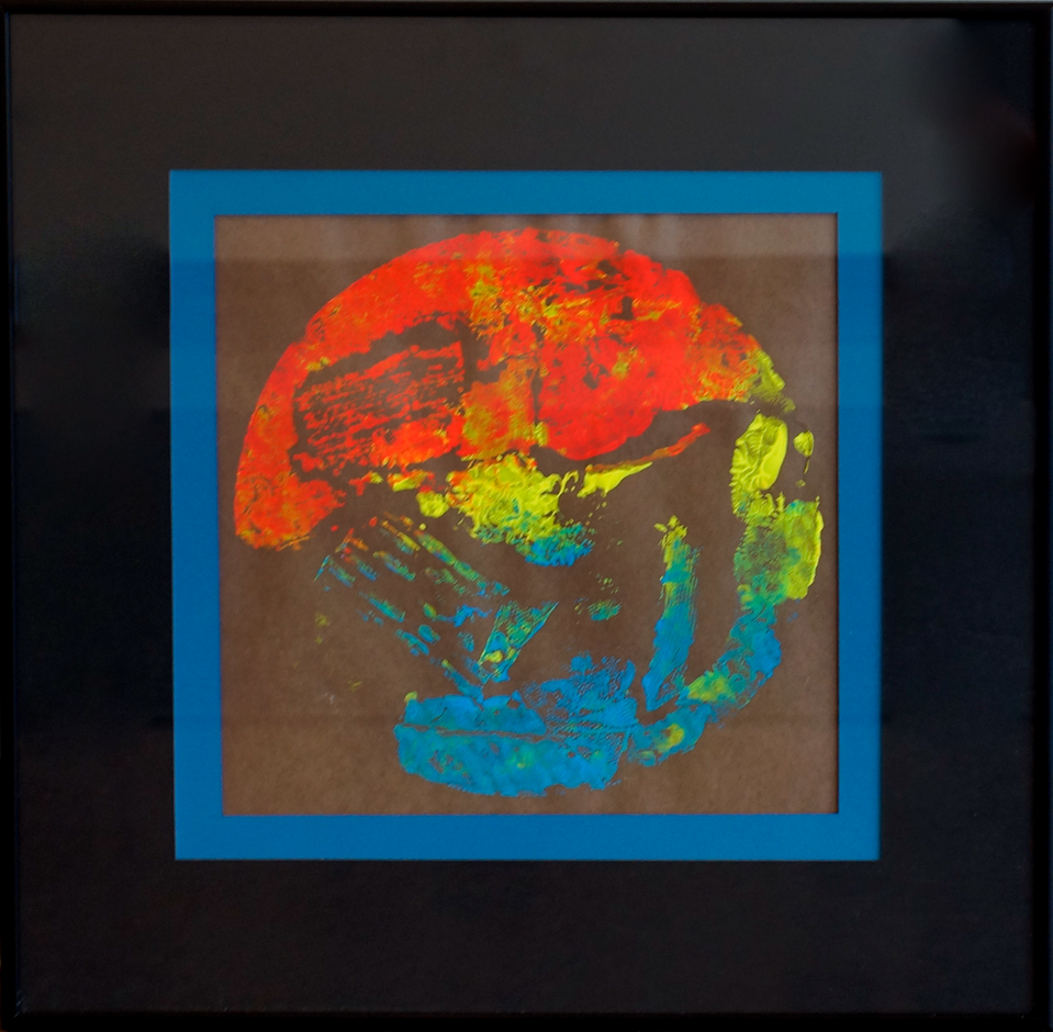A colorful print in the shape of a circle on a black background.