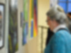 A woman experiencing art at an exhibition.